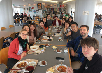 Program participants celebrating the birthday of a classmate during lunch.